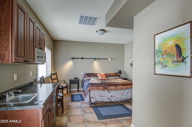 tiled bedroom with sink