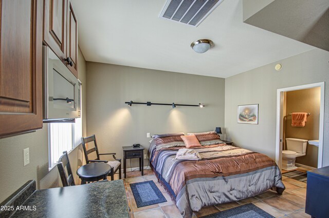 bedroom featuring light tile patterned floors