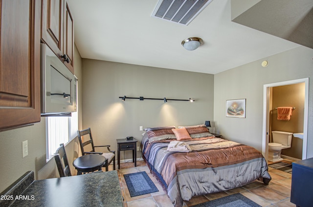 bedroom with light tile patterned flooring