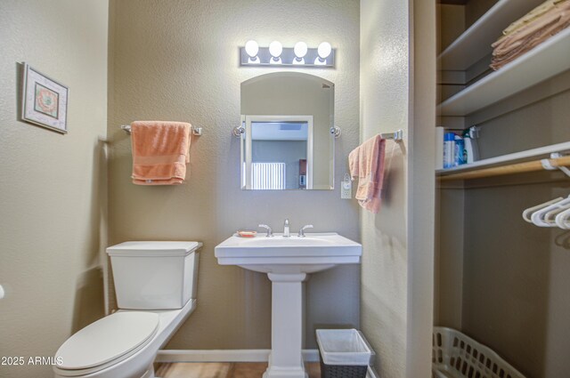 bathroom featuring toilet