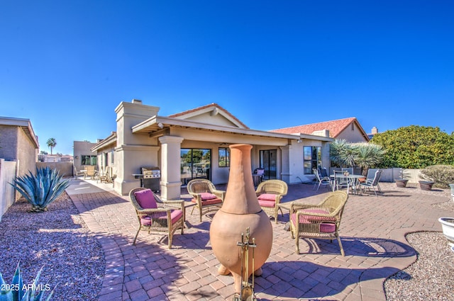 rear view of property with a patio area