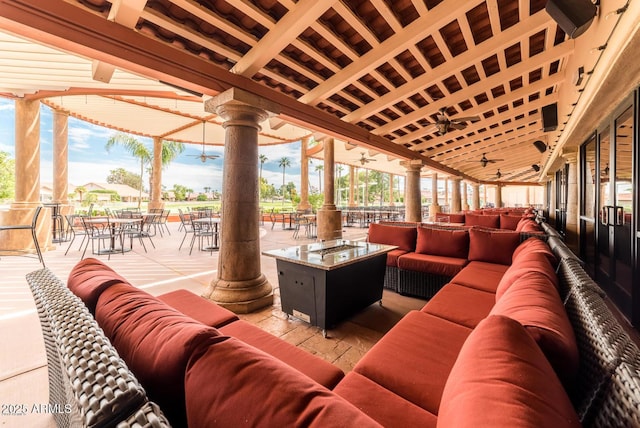 view of patio with outdoor lounge area and ceiling fan