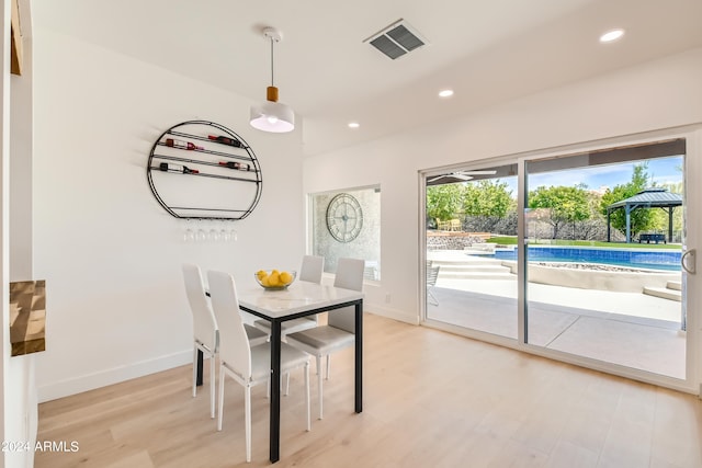 unfurnished dining area with light hardwood / wood-style floors