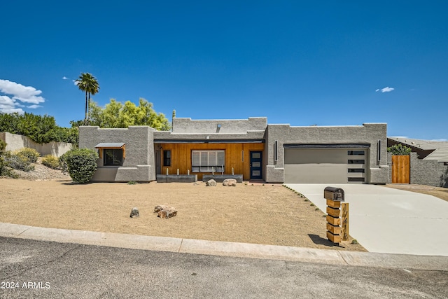 southwest-style home featuring a garage