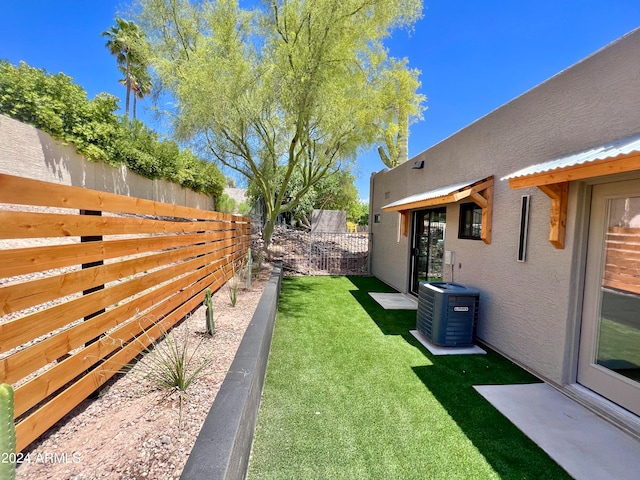 view of yard featuring central AC