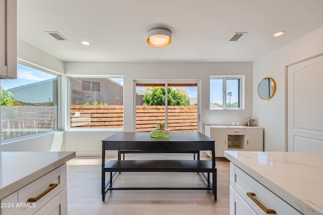 dining room with light wood-type flooring