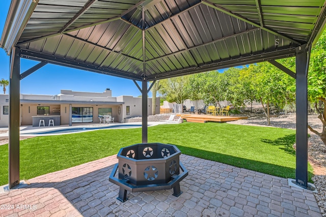 view of terrace featuring a gazebo and a fenced in pool