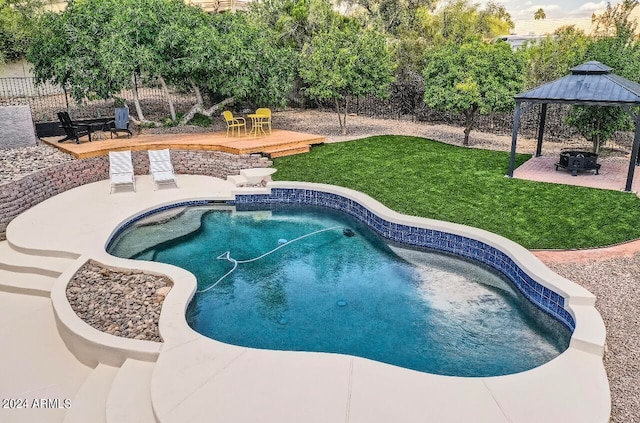 view of swimming pool with a patio and a gazebo