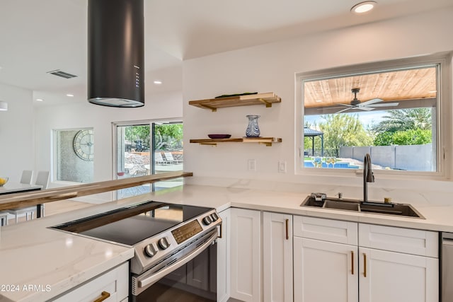 kitchen featuring stainless steel range with electric cooktop, ceiling fan, dishwasher, white cabinetry, and sink