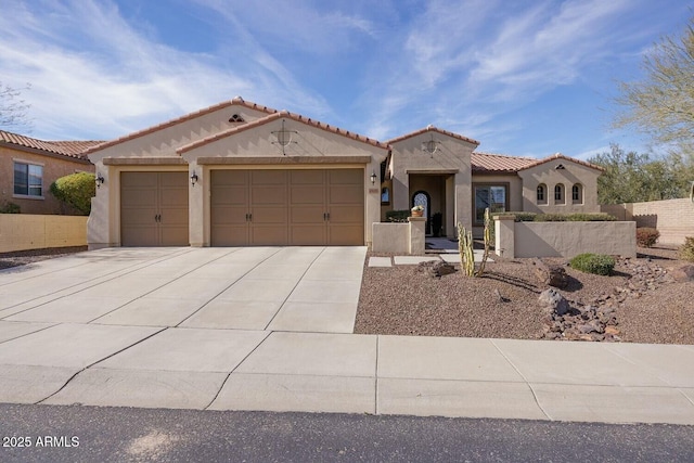 mediterranean / spanish-style house with a garage