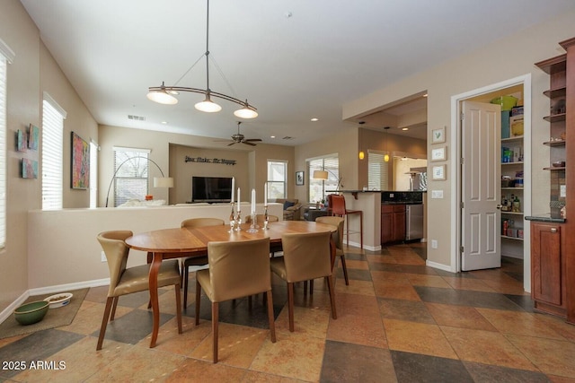 dining area featuring ceiling fan