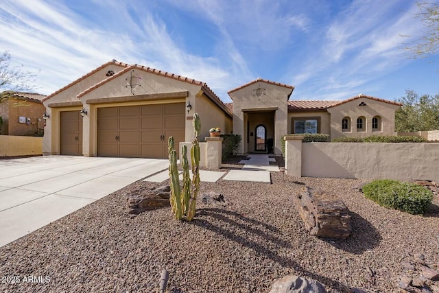 mediterranean / spanish house with a garage