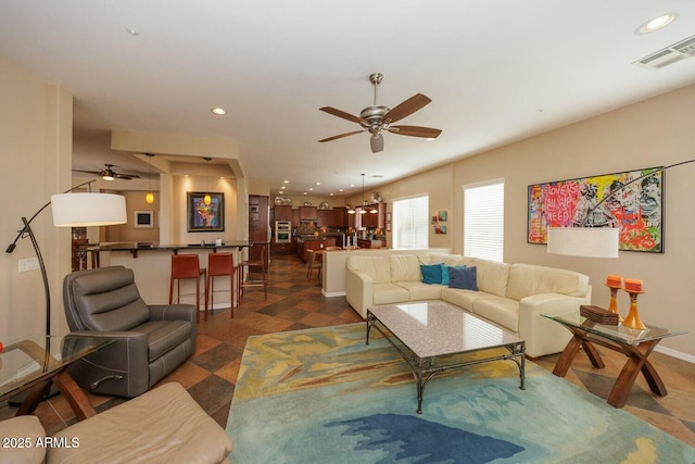 living room featuring ceiling fan