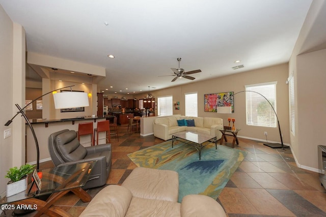 living room with ceiling fan