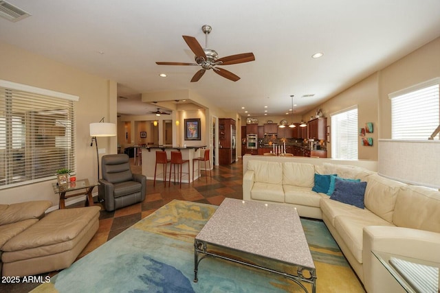 living room with ceiling fan