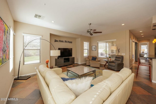 living room featuring ceiling fan