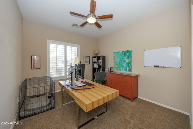 carpeted office featuring ceiling fan