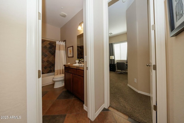 full bathroom with tile patterned flooring, vanity, toilet, and shower / bath combo with shower curtain