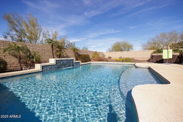 view of swimming pool with a patio area and pool water feature