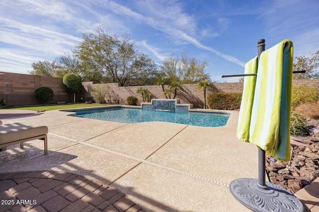 view of swimming pool with a patio