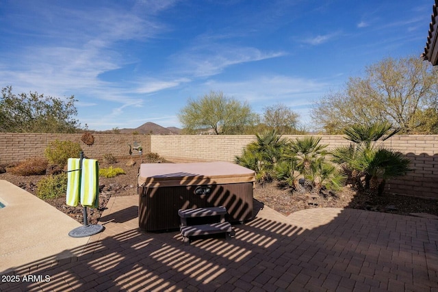 view of patio featuring a hot tub