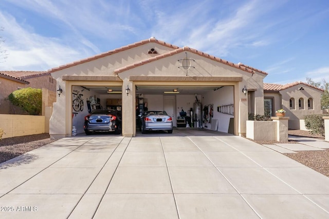 mediterranean / spanish home with a garage and gas water heater