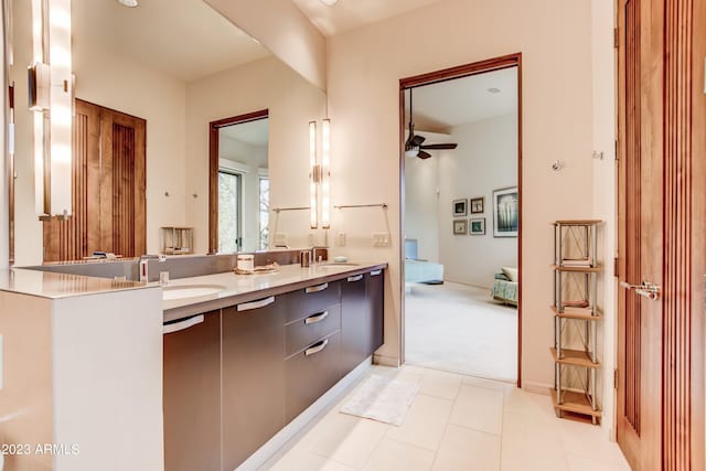 bathroom featuring tile flooring, ceiling fan, and dual bowl vanity