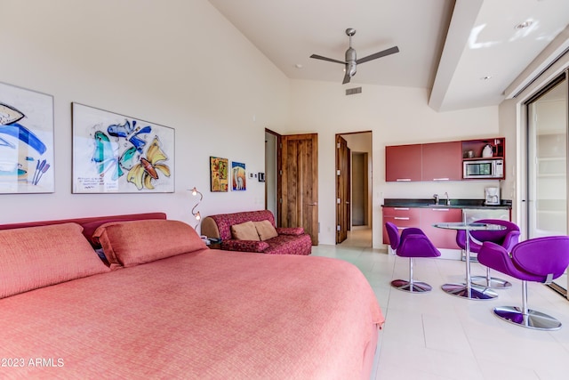 tiled bedroom featuring a high ceiling, ceiling fan, and sink