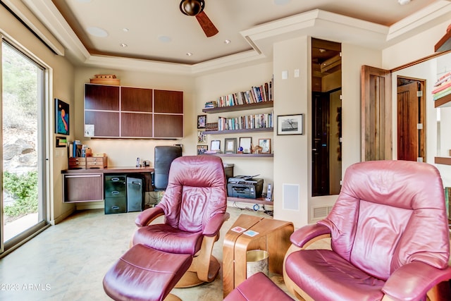 interior space with crown molding, a raised ceiling, ceiling fan, and a wealth of natural light