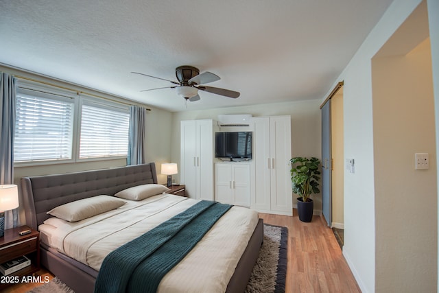 bedroom featuring ceiling fan and light wood-type flooring