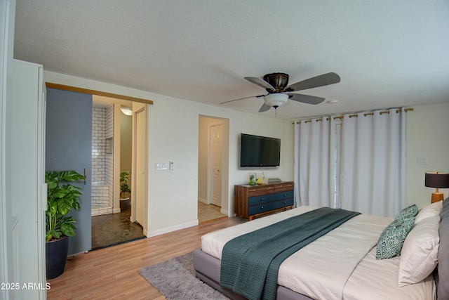 bedroom featuring ceiling fan and light hardwood / wood-style floors