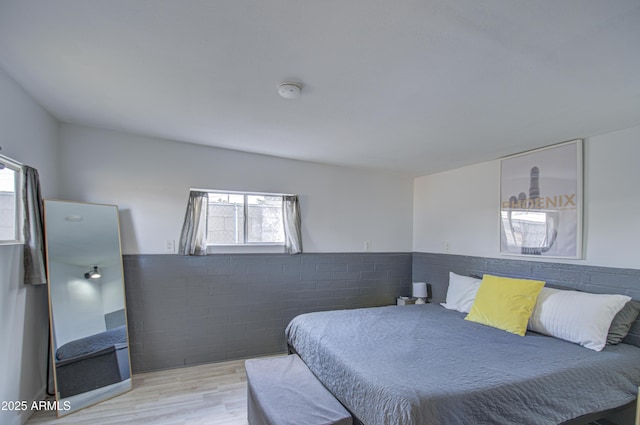 bedroom with light wood-type flooring