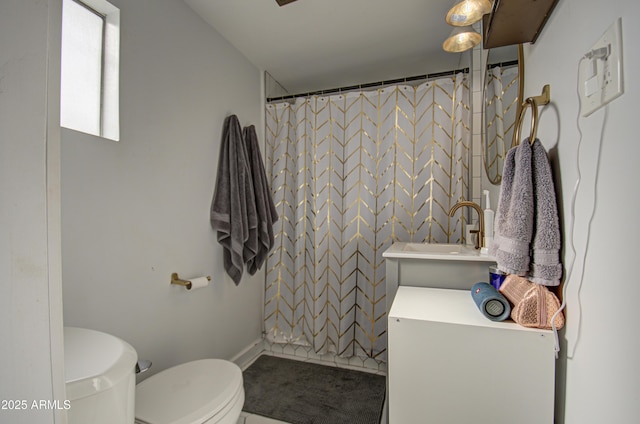 bathroom with a shower with shower curtain, toilet, sink, and tile patterned floors