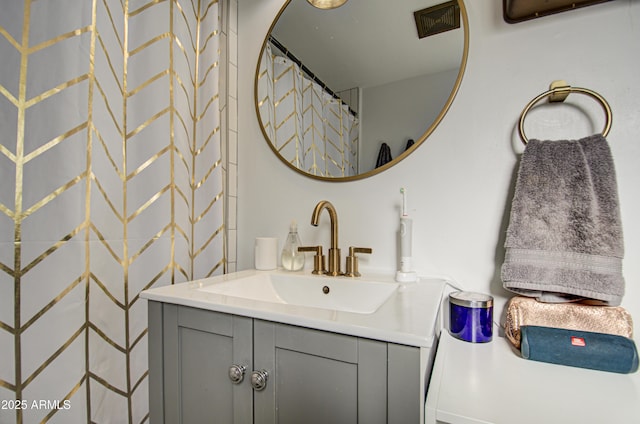 bathroom with a shower with curtain and vanity