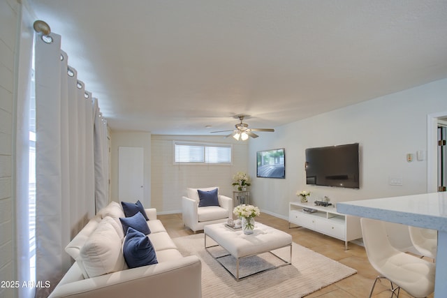 tiled living room with ceiling fan