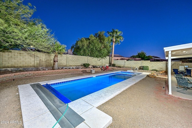 view of swimming pool with a patio area