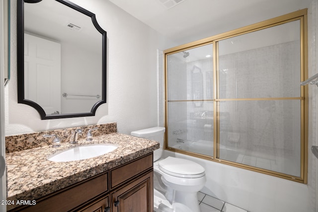 full bathroom featuring shower / bath combination with glass door, vanity, toilet, and tile patterned floors