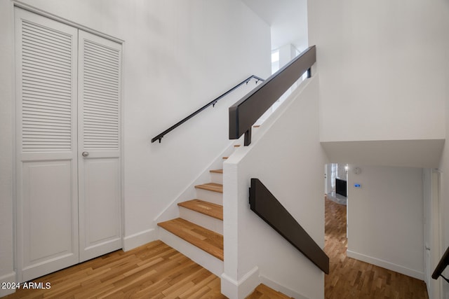 stairs featuring wood-type flooring