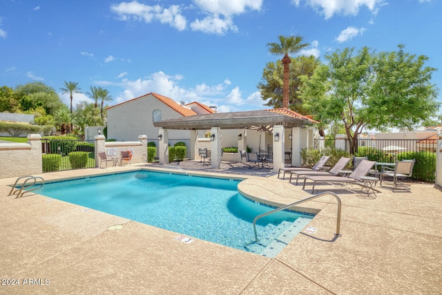 view of swimming pool with a patio area