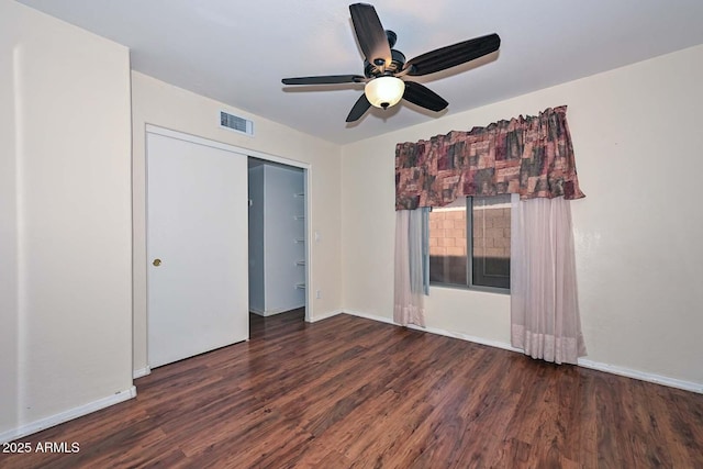 16828 W Windermere Way, Surprise, AZ 85374 - unfurnished bedroom featuring wood finished floors, a ceiling fan, and a closet