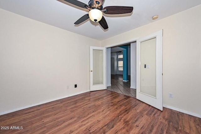 16828 W Windermere Way, Surprise, AZ 85374 - unfurnished bedroom featuring wood finished floors and ceiling fan