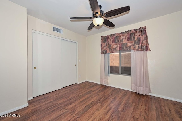 16828 W Windermere Way, Surprise, AZ 85374 - unfurnished bedroom featuring wood finished floors, a closet, and a ceiling fan