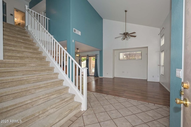 16828 W Windermere Way, Surprise, AZ 85374 - entrance foyer with a ceiling fan, stairs, high vaulted ceiling, and wood finished floors