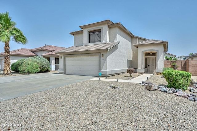 16828 W Windermere Way, Surprise, AZ 85374 - view of front of home with stucco siding, concrete driveway, an attached garage, and a tiled roof