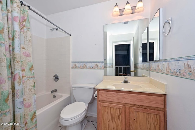 16828 W Windermere Way, Surprise, AZ 85374 - bathroom with shower / bathtub combination with curtain, vanity, tile patterned floors, and wainscoting