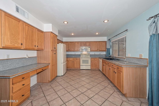 16828 W Windermere Way, Surprise, AZ 85374 - kitchen featuring white appliances, recessed lighting, built in desk, and light tile patterned floors