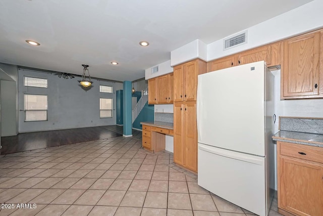 16828 W Windermere Way, Surprise, AZ 85374 - kitchen with freestanding refrigerator, light tile patterned floors, recessed lighting, and pendant lighting
