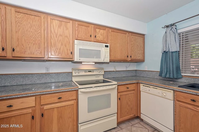 16828 W Windermere Way, Surprise, AZ 85374 - kitchen featuring white appliances and dark countertops