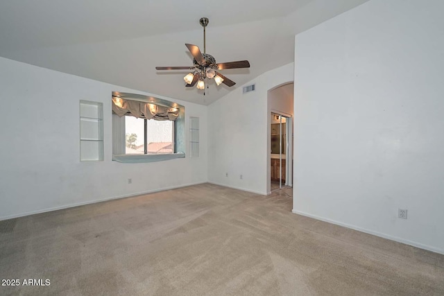 16828 W Windermere Way, Surprise, AZ 85374 - empty room with ceiling fan, carpet floors, arched walkways, and vaulted ceiling