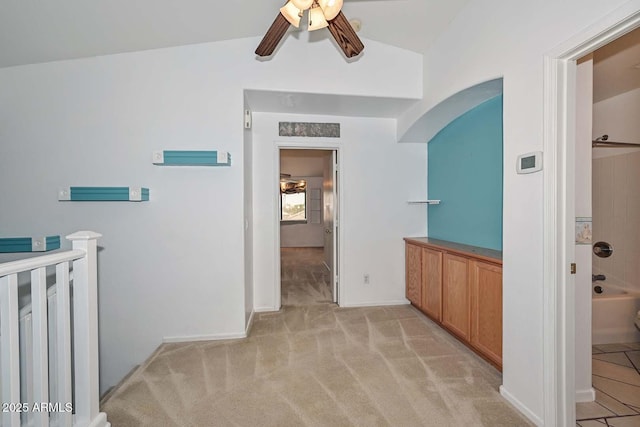 16828 W Windermere Way, Surprise, AZ 85374 - hall with lofted ceiling, arched walkways, and light carpet